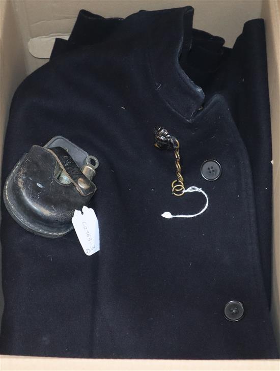 A vintage policemans cape, three whistles and a holster